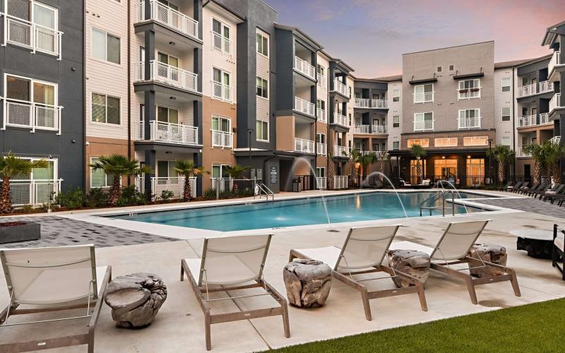 a pool with chairs around it