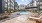 pool with fountains next to fire pit and lounge chairs